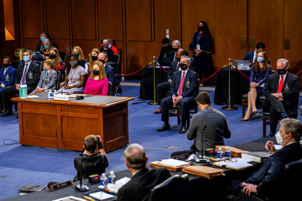 Supreme Court nominee Amy Coney Barrett listens during her Senate Judiciary Committee confirmat ...