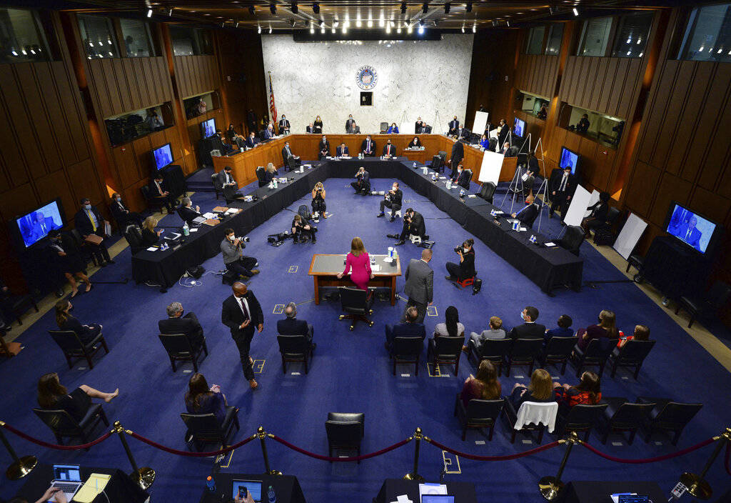 Supreme Court nominee Amy Coney Barrett arrives for her Senate Judiciary Committee confirmation ...