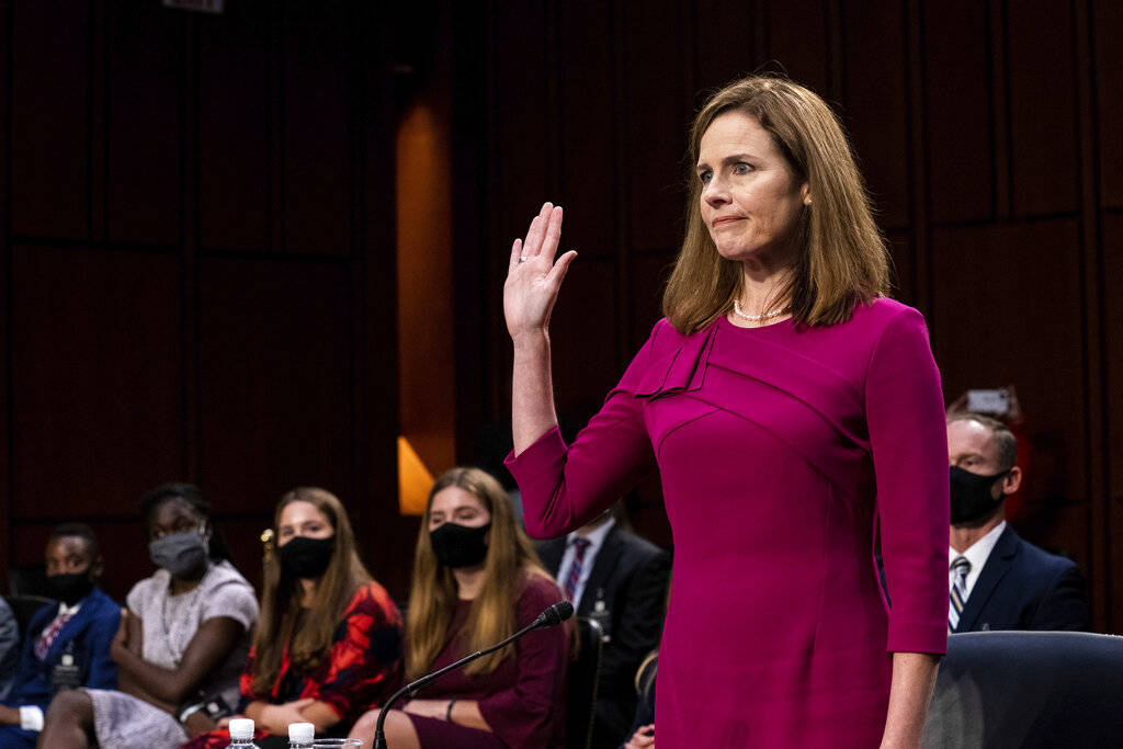 Supreme Court nominee Amy Coney Barrett is sworn in during her Senate Judiciary Committee confi ...