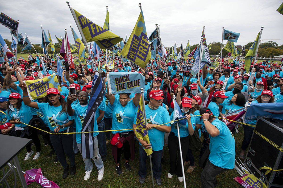 Supporters of President Donald Trump rally at The Ellipse, before entering to The White House, ...