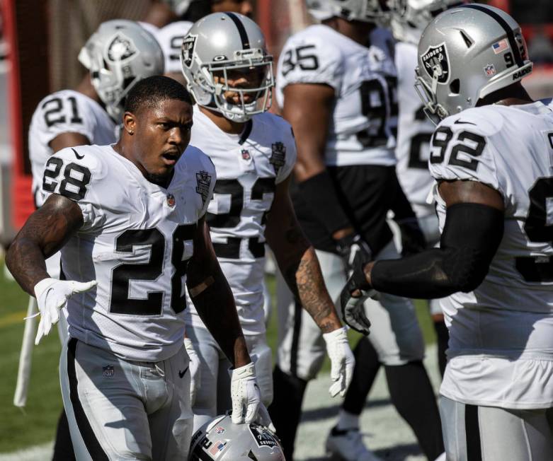 Las Vegas Raiders running back Josh Jacobs (28) fires up his team during warm ups before the st ...