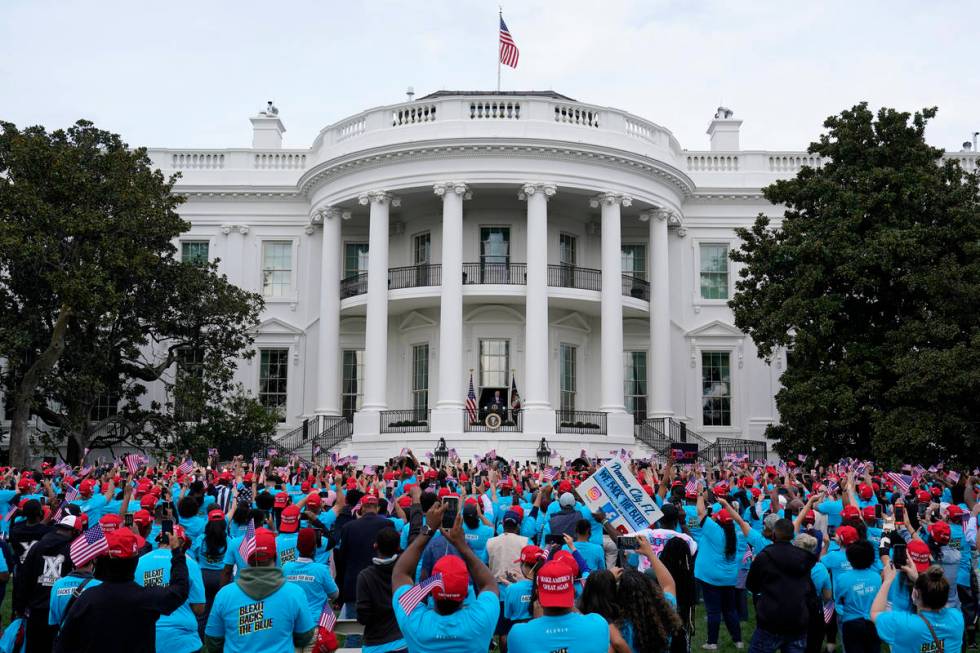 President Donald Trump speaks from the Blue Room Balcony of the White House to a crowd of suppo ...