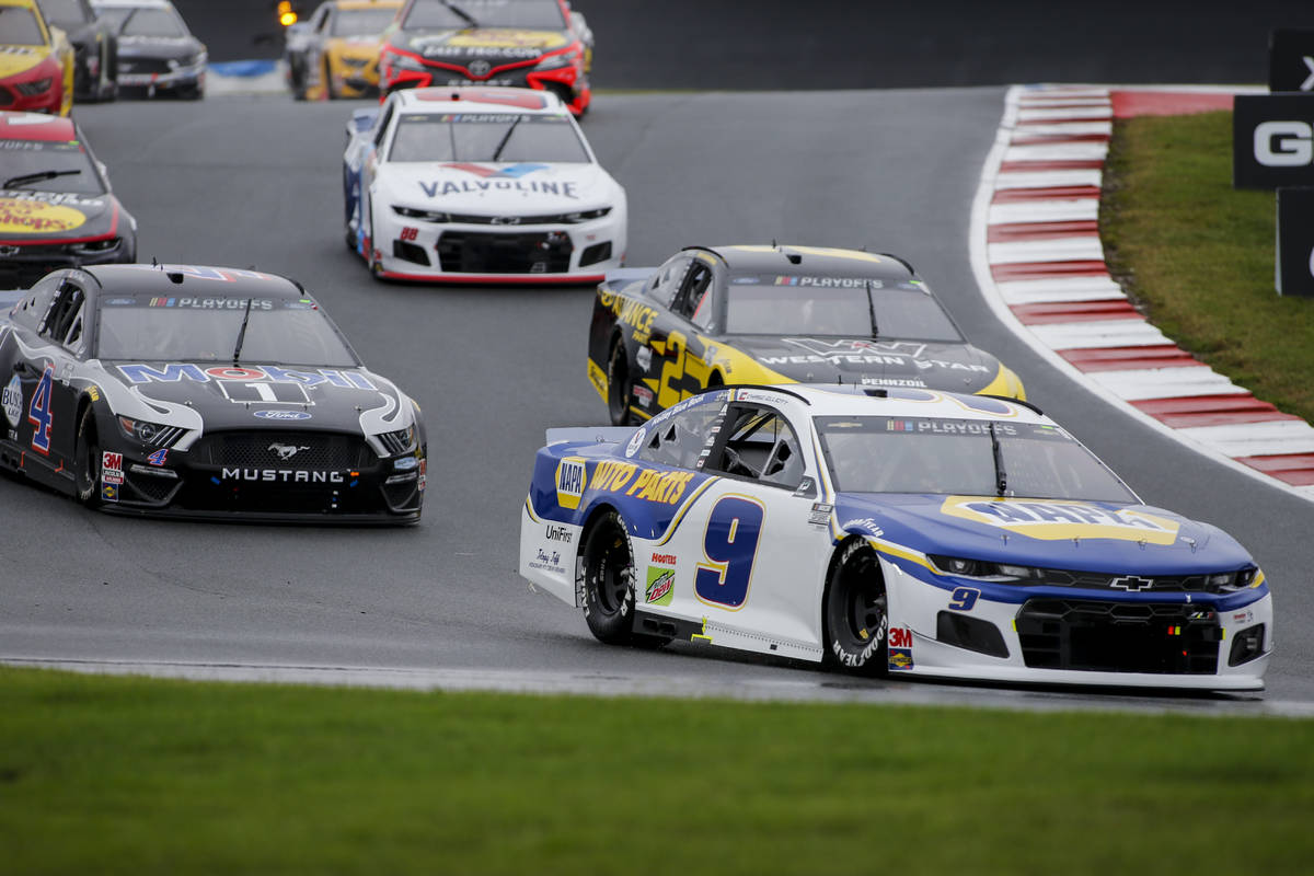 Chase Elliott (9) leads the way out of Turn 7 in a NASCAR Cup Series auto race at Charlotte Mot ...