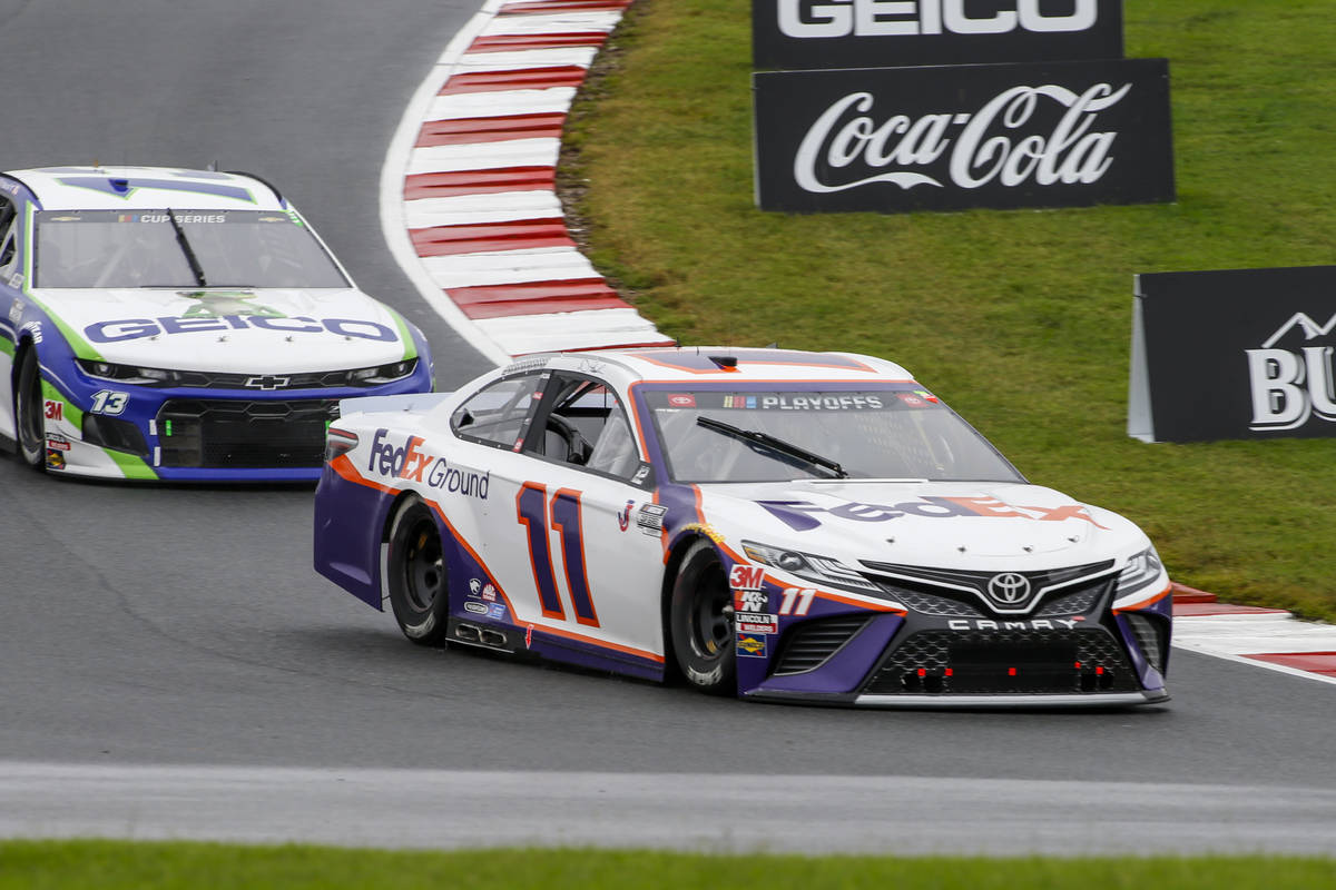 Denny Hamlin (11) competes in a NASCAR Cup Series auto race at Charlotte Motor Speedway in Conc ...