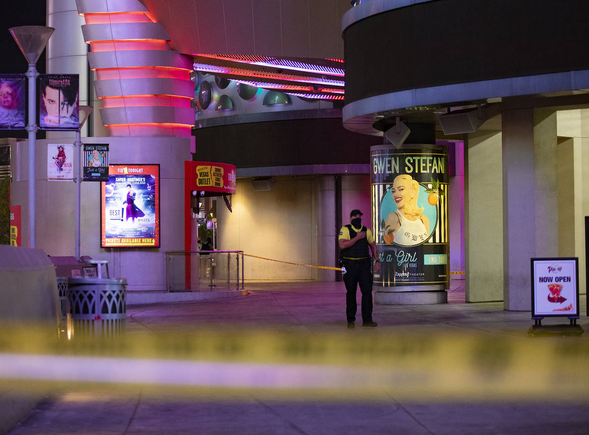 A security guard at the scene on the Strip where a man was shot at the Miracle Miles shops in L ...