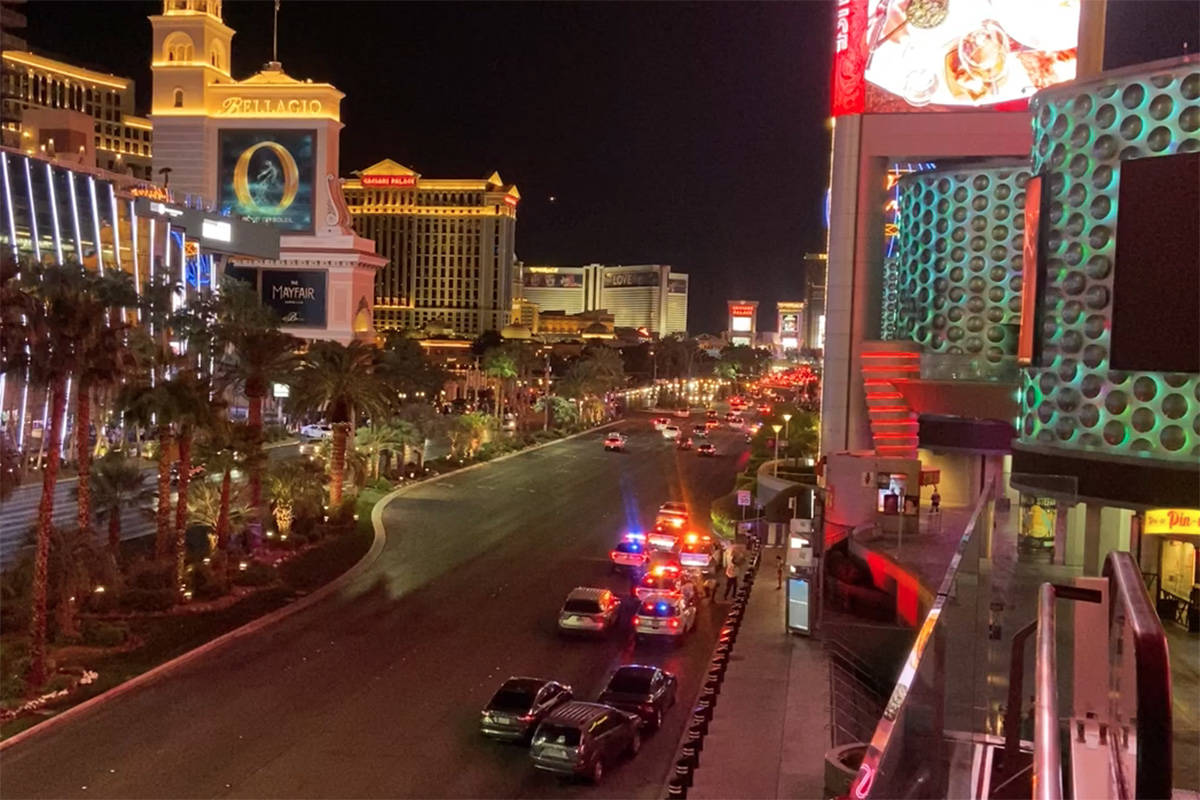 Police investigate a shooting at the Miracle Mile Shops on the Las Vegas Strip on Sunday, Oct. ...