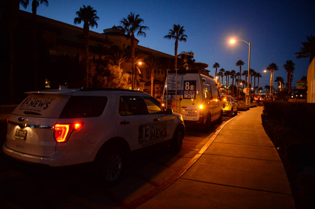 Local news station vans line up after reports of a shooting at Green Valley Ranch casino in Hen ...