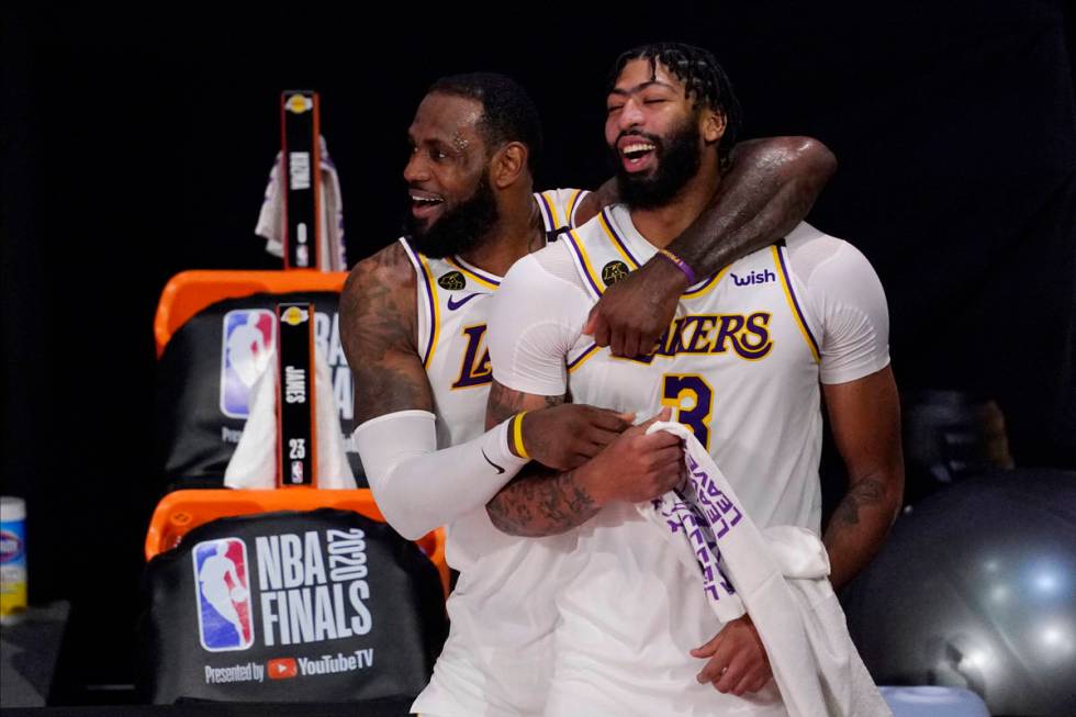 Los Angeles Lakers' LeBron James (23) and Anthony Davis (3) celebrate after the Lakers defeated ...
