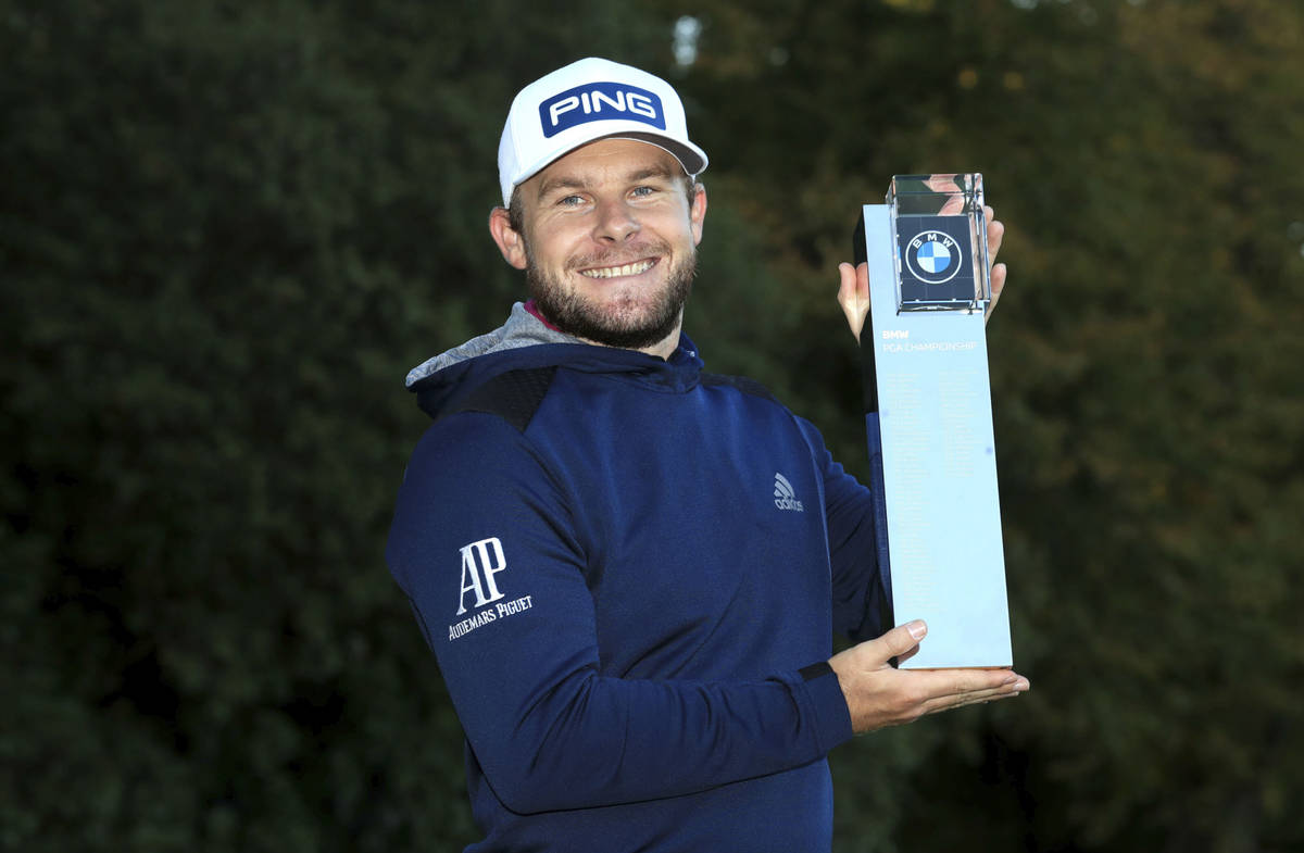 England's Tyrrell Hatton poses with the trophy after winning the PGA Championship at the Wentwo ...