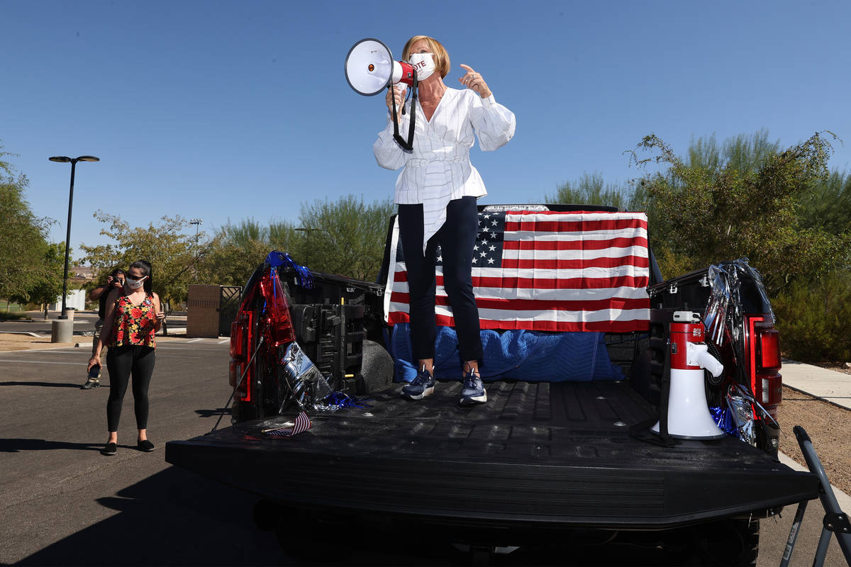 U.S. Rep. Susie Lee, D-Nev., speaks to supporters before a ballot drop off parade at Heritage ...