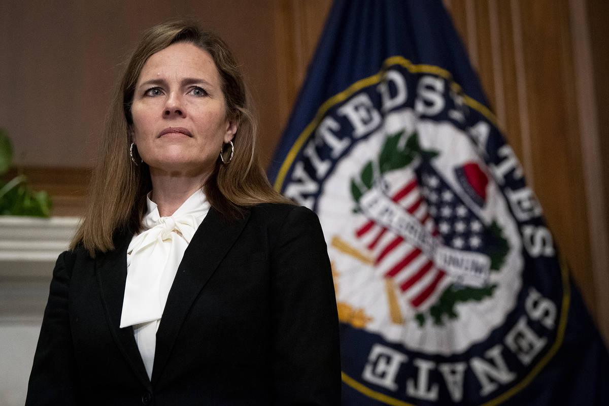 Supreme Court nominee Judge Amy Coney Barrett, meets with Sen. Joni Ernst, R-Iowa, not shown, T ...