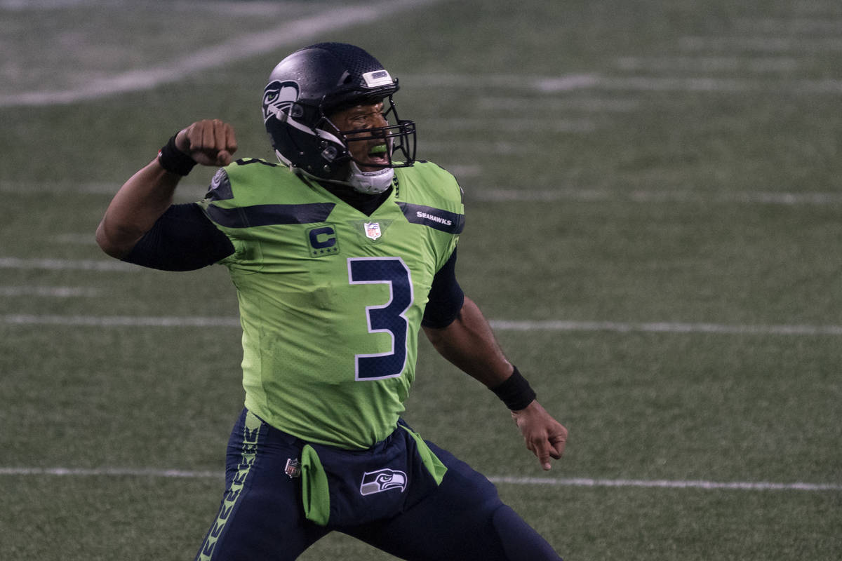 Seattle Seahawks quarterback Russell Wilson reacts after throwing the game winning touchdown du ...