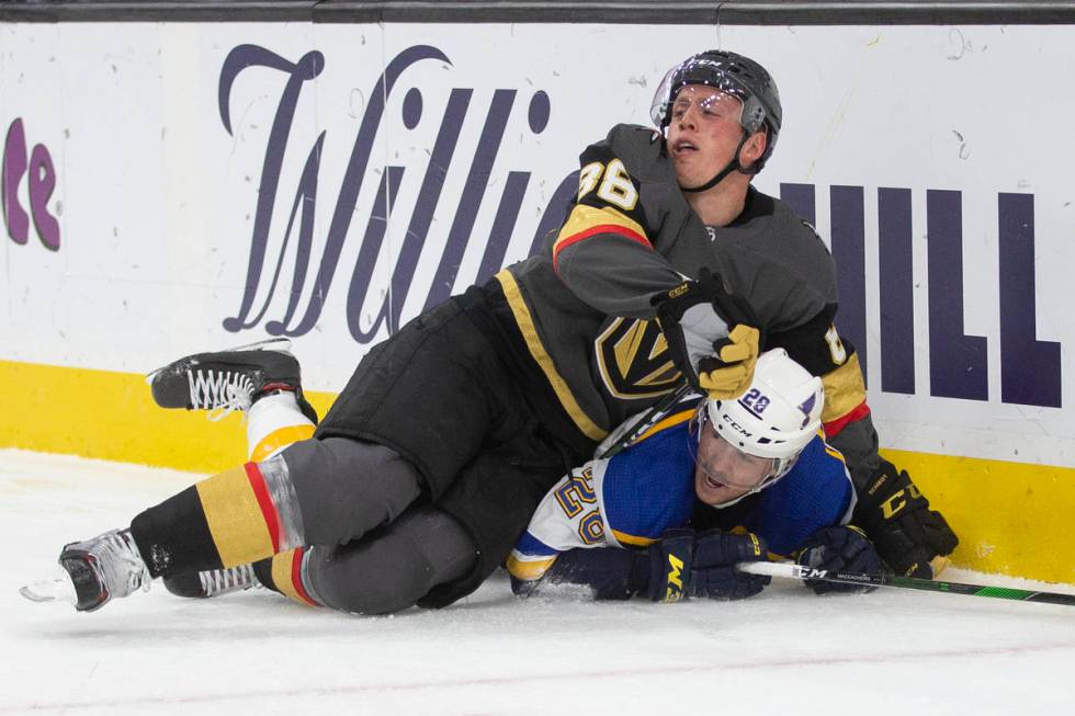 Vegas Golden Knights defenseman Nate Schmidt (88) collides with St. Louis Blues left wing Macke ...