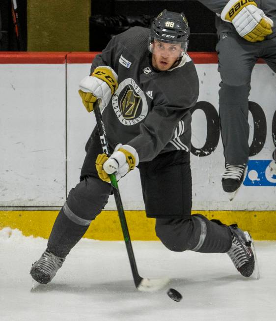 Vegas Golden Knights defenseman Nate Schmidt (88) eyes a teammate as he shoots the puck during ...