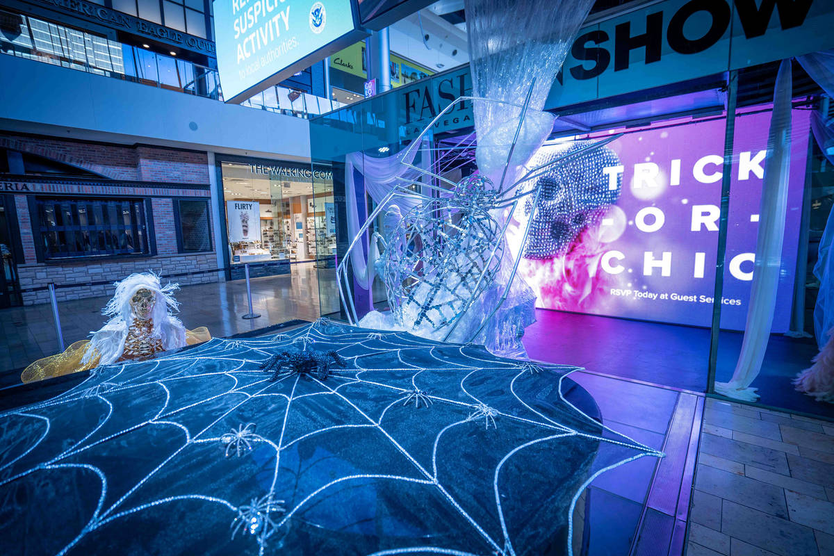 The Great Hall features a spider web installation and mummy fashion exhibit. (Fashion Show mall)