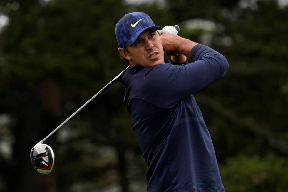 This Aug. 8, 2020, file photo shows Brooks Koepka watching his tee shot on the 14th hole during ...