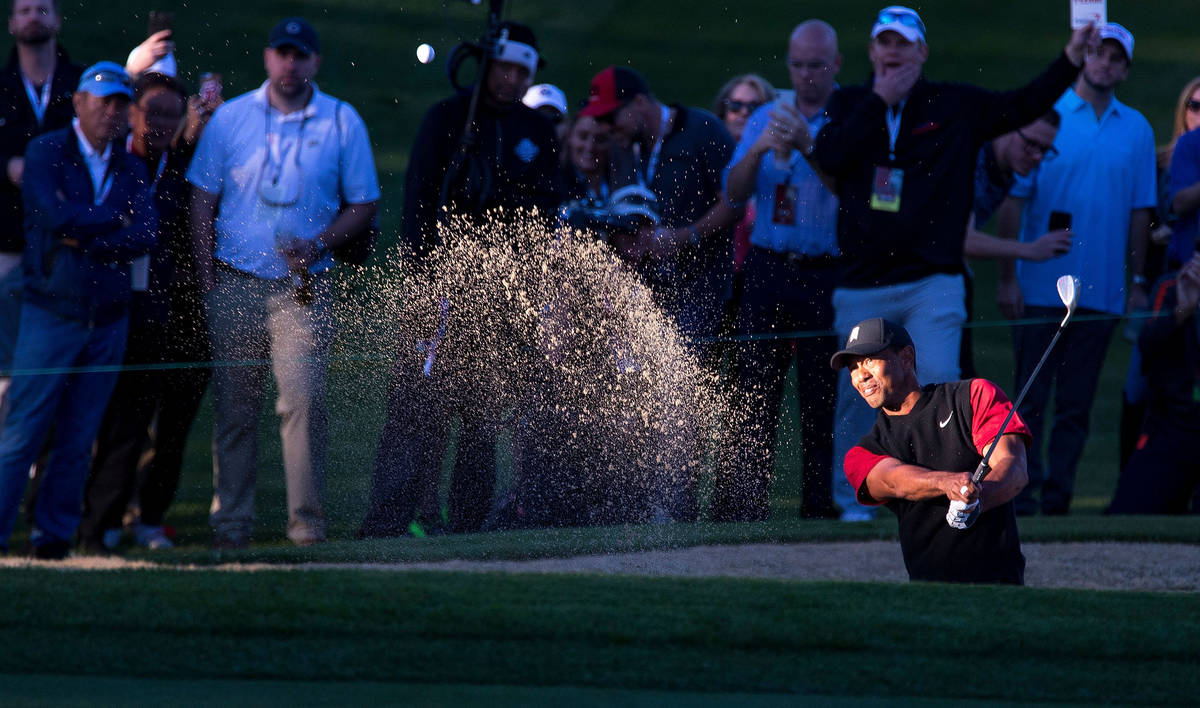 In this Nov. 23, 2018, file photo, Tiger Woods hits from a bunker on the 16th during The Match ...
