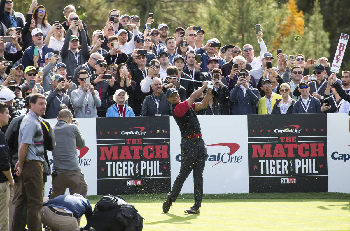 In this Nov. 23, 2018, Tiger Woods hits from the first tee box during The Match at Shadow Creek ...