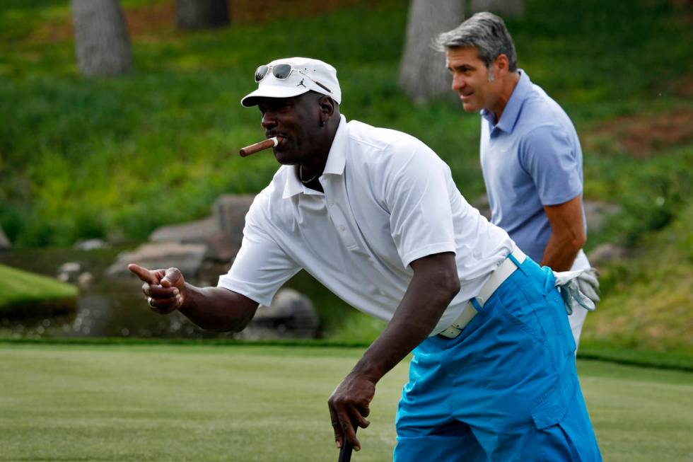 In this April 4, 2013, file photo, Michael Jordan reacts after sinking a put during the Michael ...