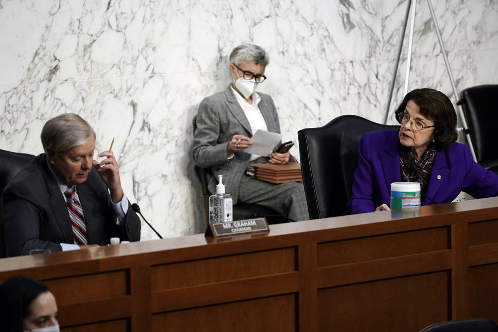 Senate Judiciary Committee Chairman Lindsey Graham, R-S.C., listens to ranking member Sen. Dian ...