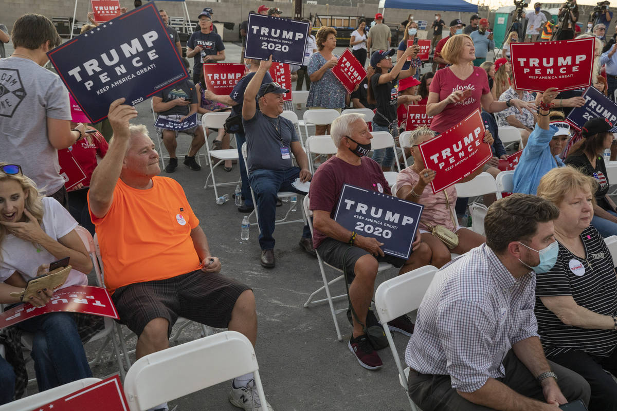 Attendees wait for Donald Trump Jr. to speak at a campaign event for President Trump on Wednesd ...