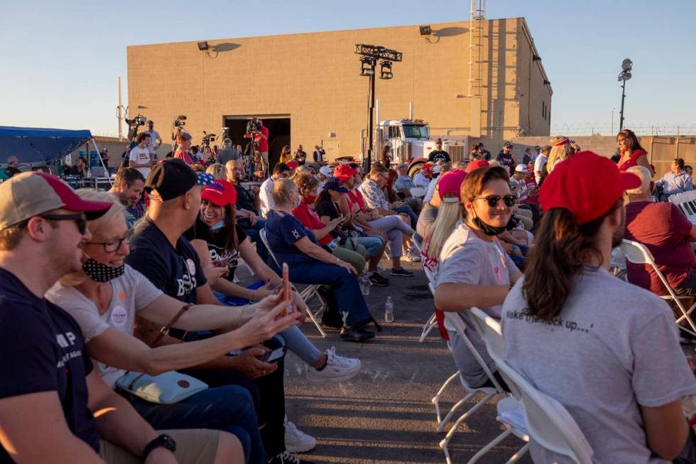 Attendees wait for Donald Trump Jr. to speak at a campaign event for President Trump on Wednesd ...