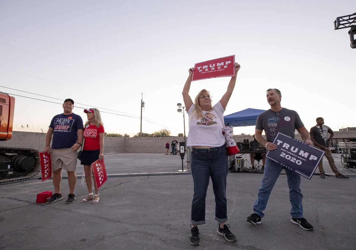 Attendees wait for Donald Trump Jr. to speak at a campaign event for President Trump on Wednesd ...