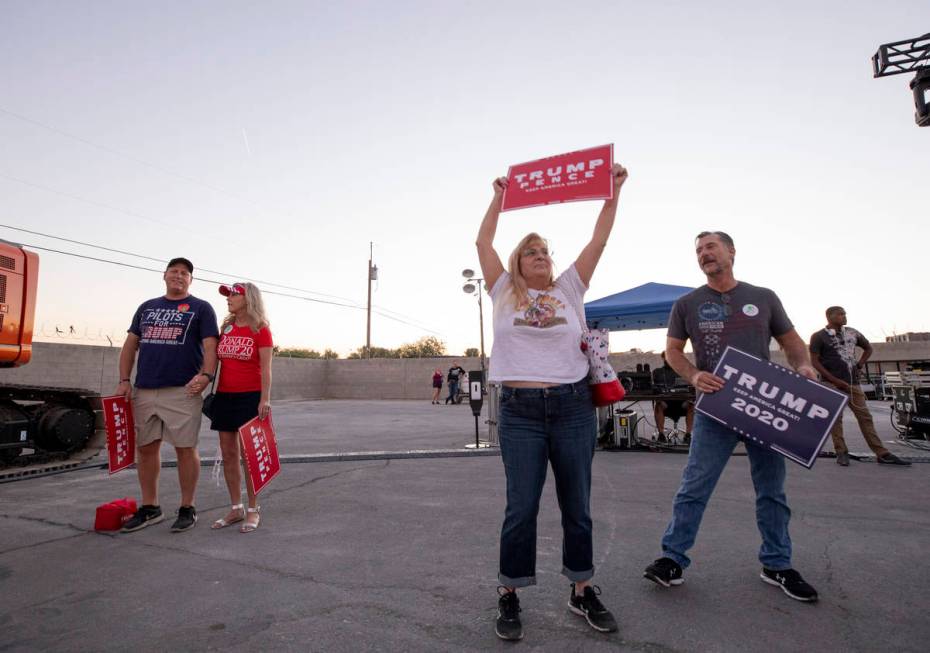 Attendees wait for Donald Trump Jr. to speak at a campaign event for President Trump on Wednesd ...