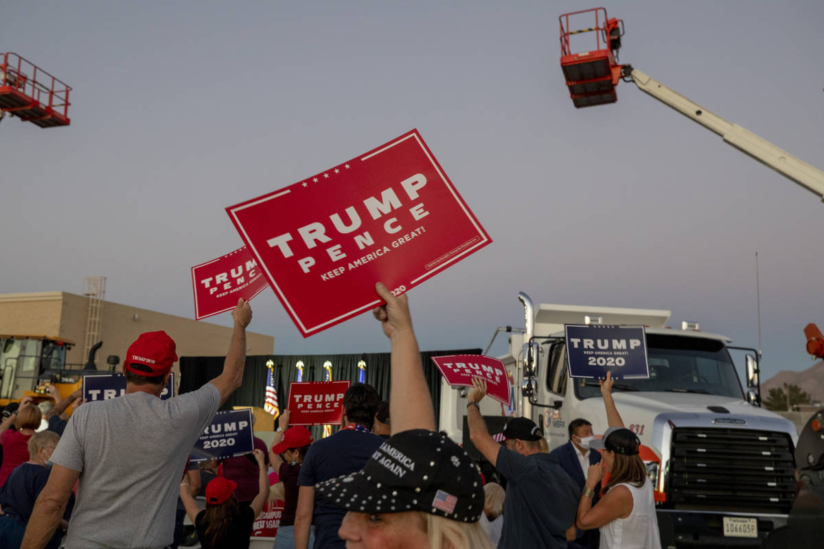 Attendees cheer waiting for Donald Trump Jr. to speak at a campaign event for President Trump o ...