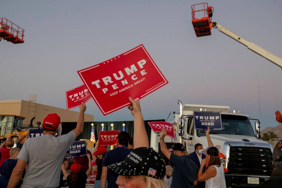 Attendees cheer waiting for Donald Trump Jr. to speak at a campaign event for President Trump o ...