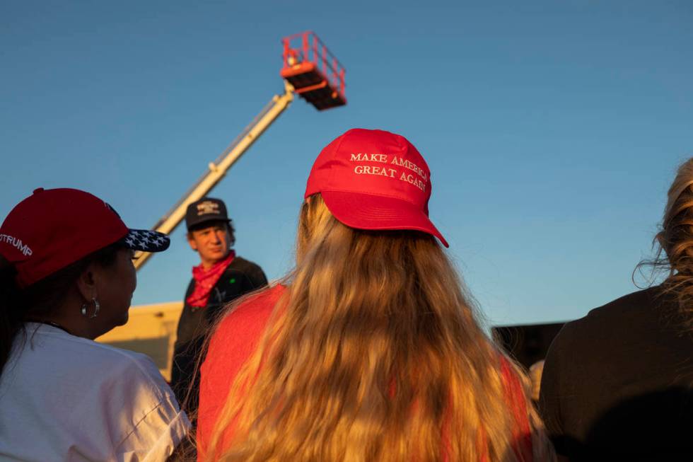 Attendees wait for Donald Trump Jr. to speak at a campaign event for President Trump on Wednesd ...