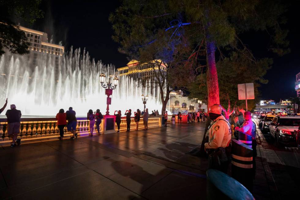 Las Vegas Metro Police are seen patrolling near the Bellagio hotel and casino fountains on the ...