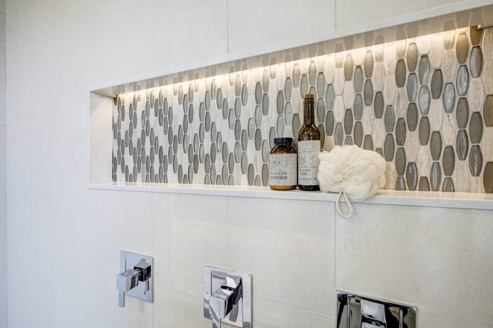 A long shower niche fitted with mosaic gray tiles is functional and beautiful. (Getty Images)