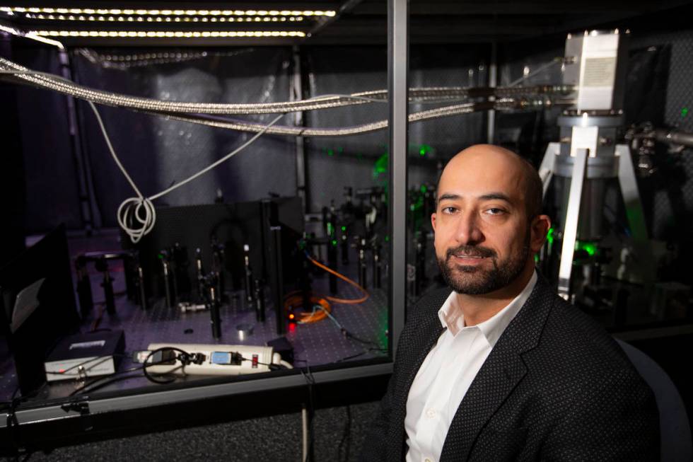 Ashkan Salamat, assistant professor of physics and astronomy at UNLV, poses for a portrait in h ...