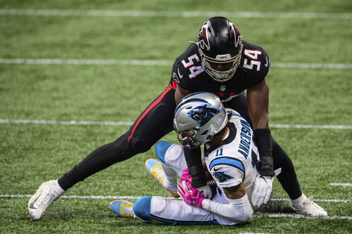 Atlanta Falcons linebacker Foye Oluokun (54) tackles Carolina Panthers wide receiver Robby Ande ...