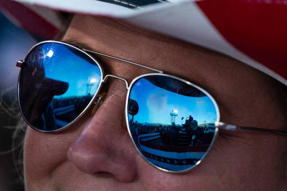 President Donald Trump is reflected in a supporter's sunglasses as he speaks at a campaign rall ...