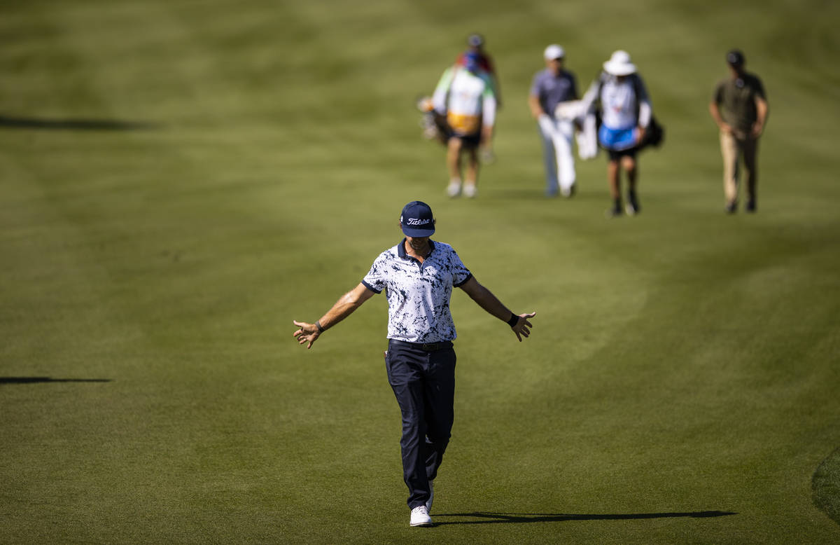 Lanto Griffin stretches his arms while walking to the fourth green during the final round of th ...