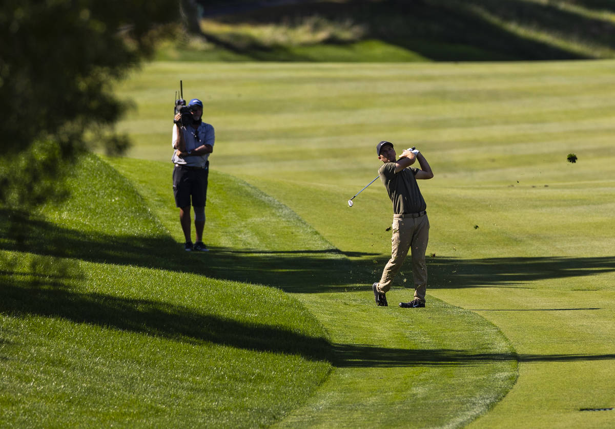 Russell Henley hits a fairway shot at the seventh hole during the final round of the CJ Cup at ...