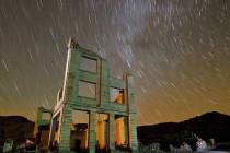Ruins of the Cook Bank building in Rhyolite, Nev., is shown in this time exposure beneath a cel ...
