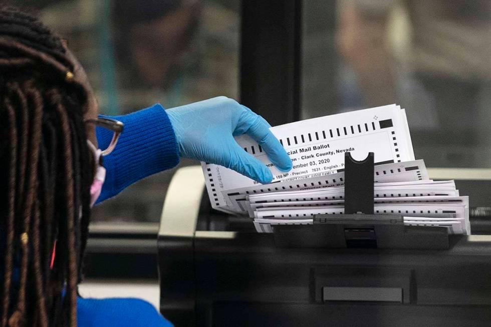 A Clark County election worker scans ballots at the Election Department warehouse, on Tuesday, ...