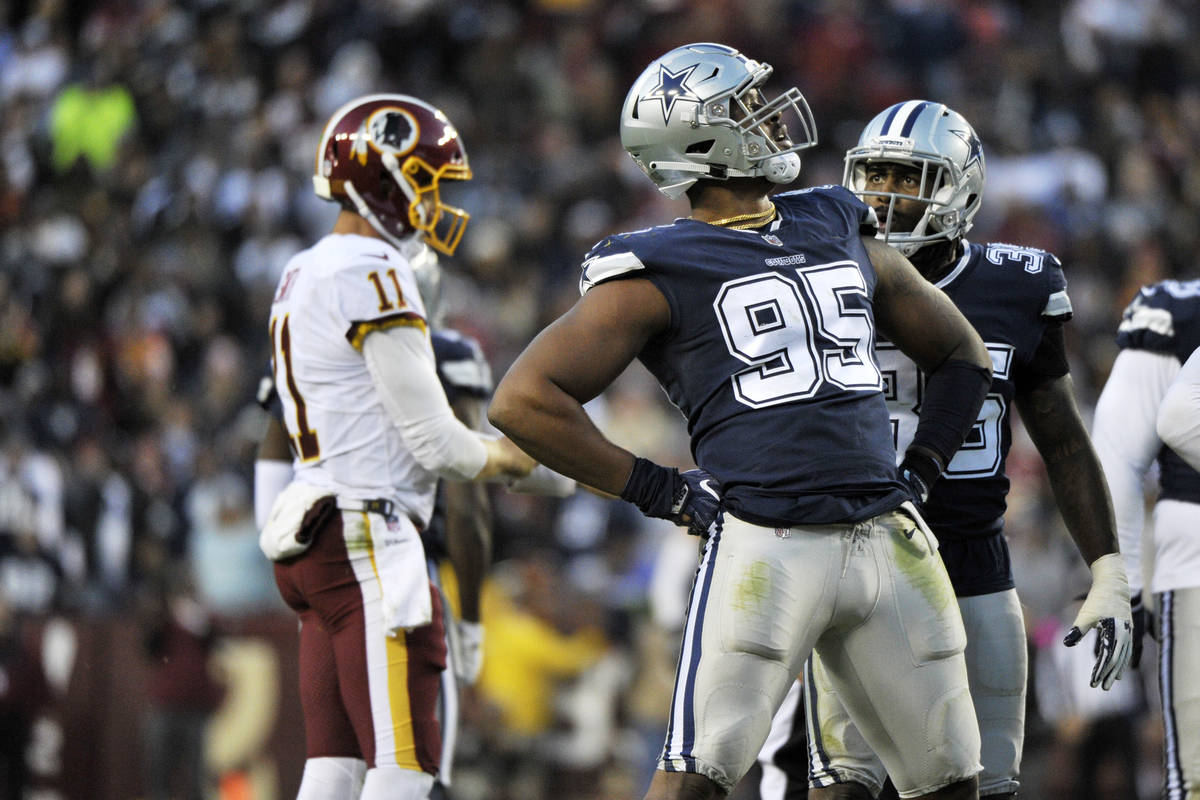 Dallas Cowboys defensive tackle David Irving (95) celebrates a sack during an NFL football game ...