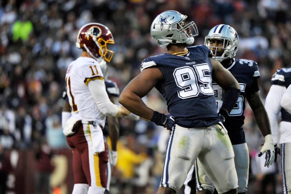 Dallas Cowboys defensive tackle David Irving (95) celebrates a sack during an NFL football game ...