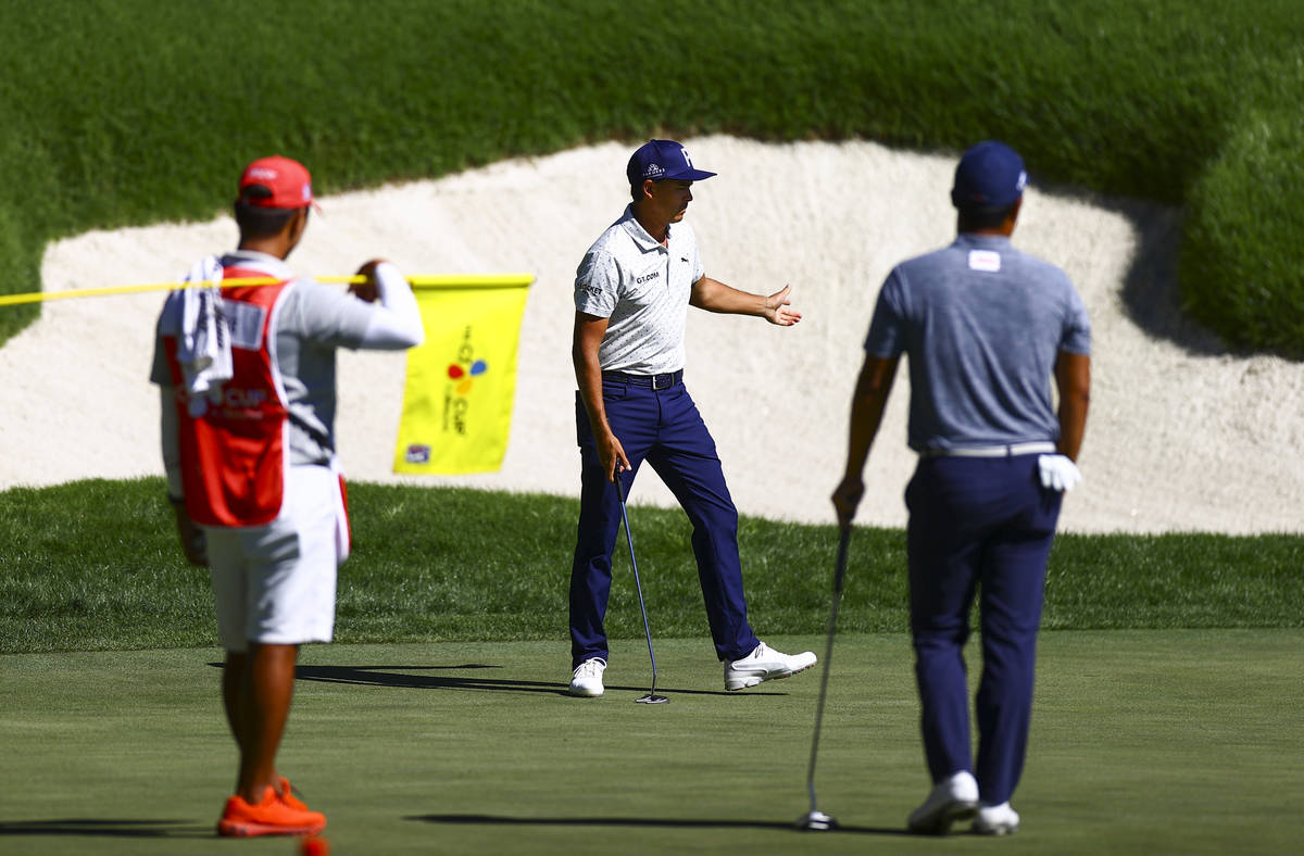 Rickie Fowler reacts after putting on the 18th green during the second round of the CJ Cup golf ...