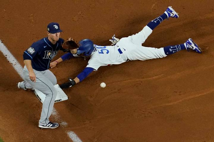 Los Angeles Dodgers right fielder Mookie Betts steals third past Tampa Bay Rays third baseman J ...