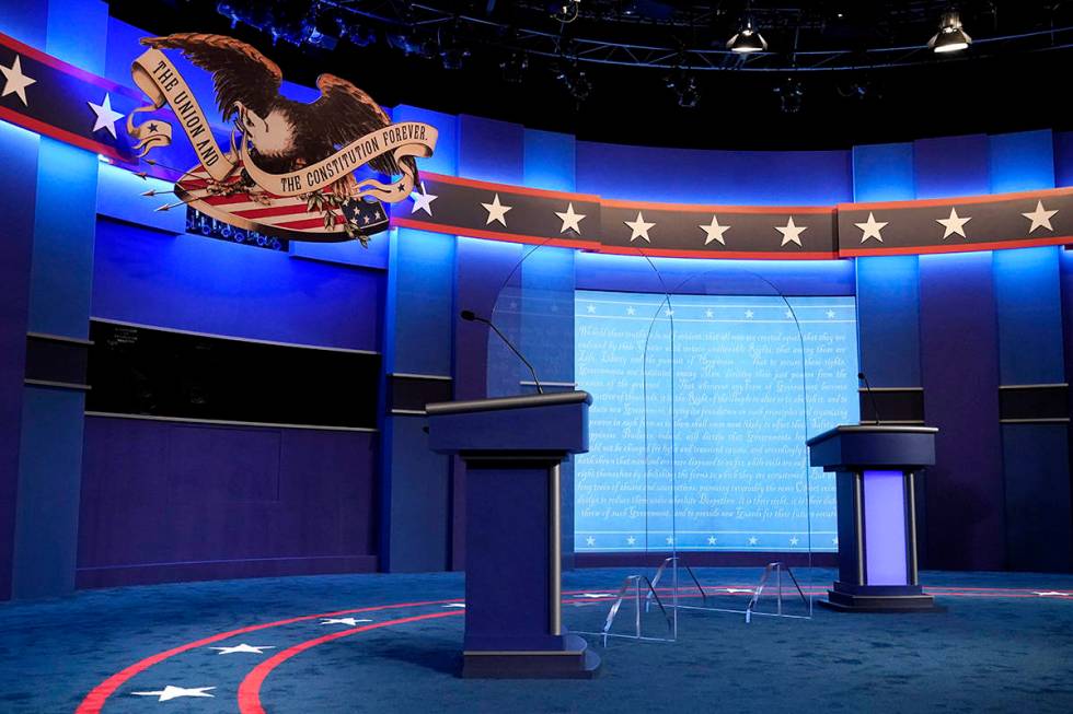 Clear protective panels stand onstage between lecterns for President Donald Trump and Democrati ...