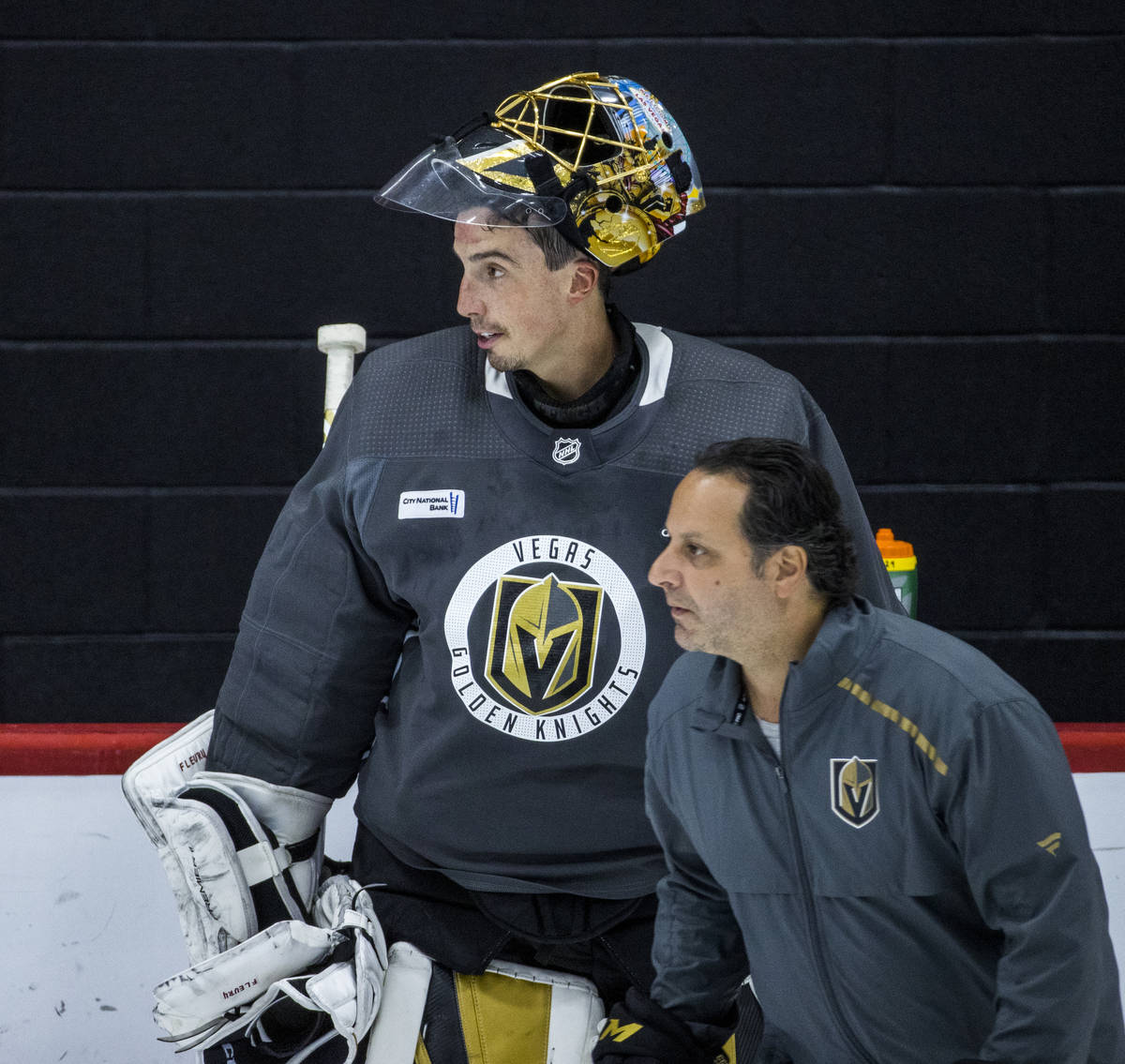 Vegas Golden Knights goaltender Marc-Andre Fleury (29, top) looks up the ice with goaltending c ...