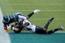 Philadelphia Eagles wide receiver Greg Ward (84) dives for a two-point conversion against Balti ...