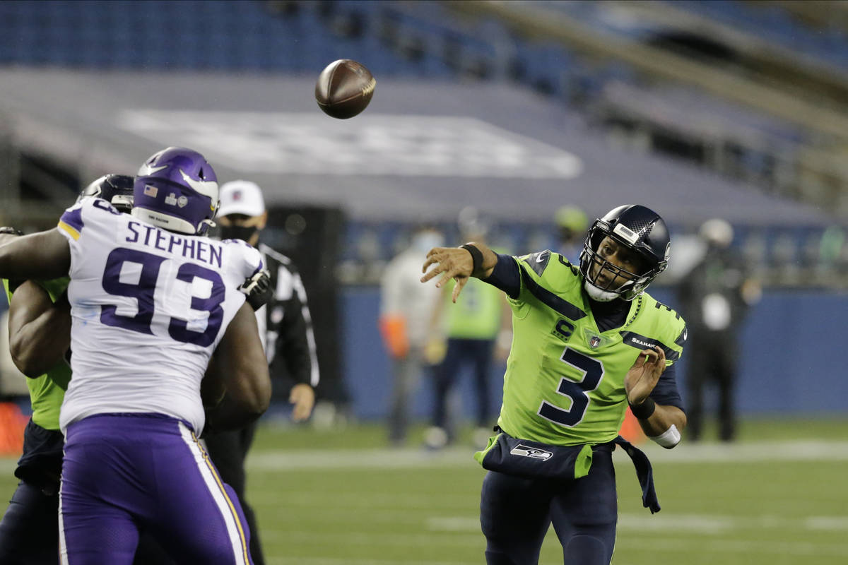 Seattle Seahawks quarterback Russell Wilson throws against the Minnesota Vikings during the sec ...