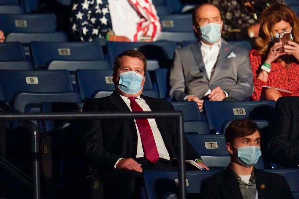 Tony Bobulinski, center seated, who says he is a former associate of Hunter Biden, waits for th ...