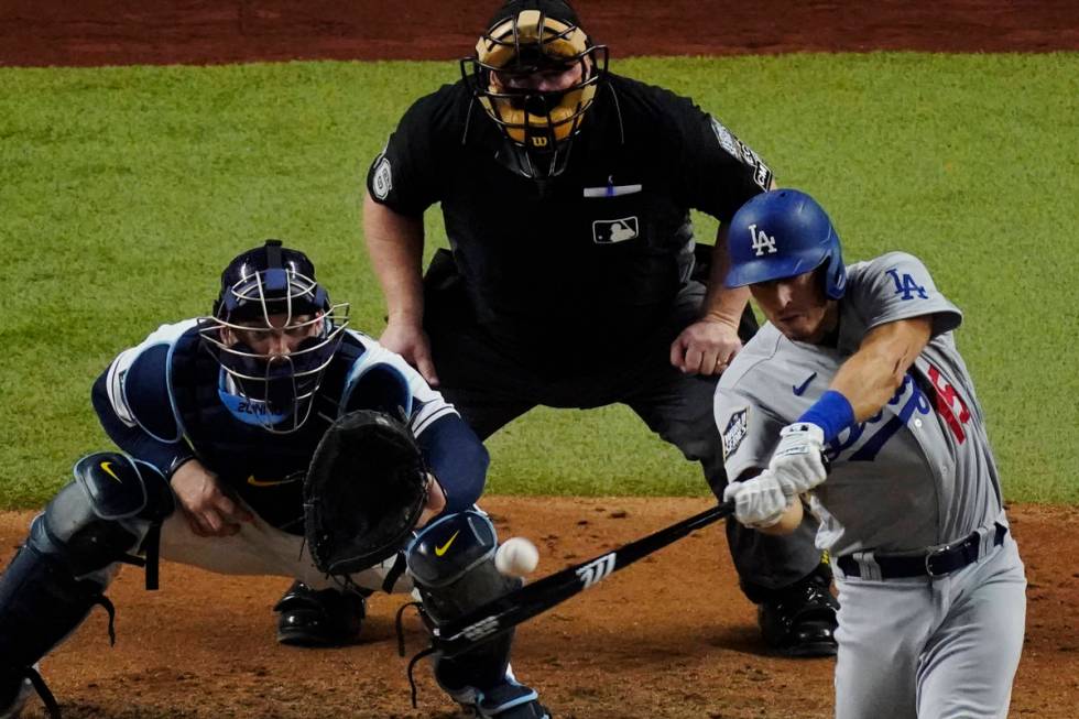 Los Angeles Dodgers' Austin Barnes hits a home run during the sixth inning in Game 3 of the bas ...